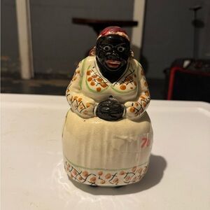 Handcrafted Ceramic Figurine with Floral Accents